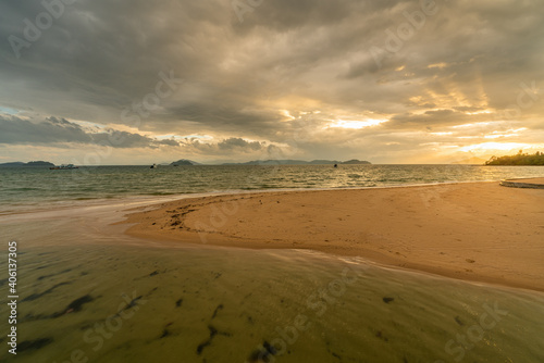 White sand beach in Phayam Island at sunset, Ranong, Thailand. © kanonsky