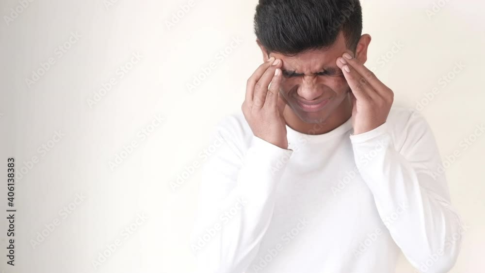 Young man cover his face with hand suffering headache, Young man cover his face with hand suffering headache,