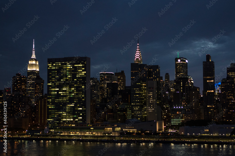 Fototapeta premium Evening skyline of Manhattan with the Empire State Building and the Chrysler Building - New York City, USA