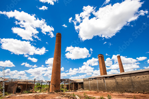 abandoned ruined factory, chimneys