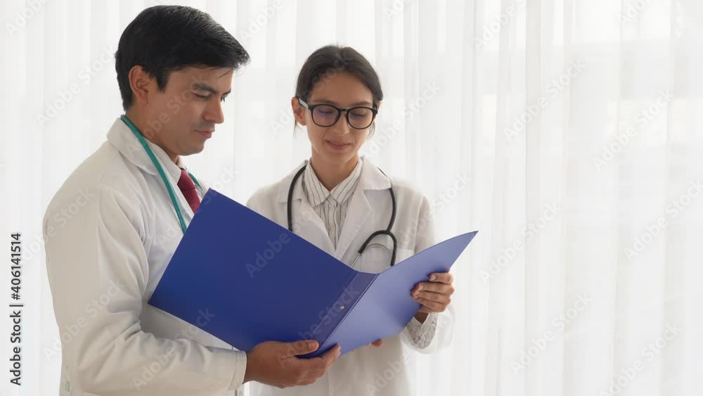 Happy doctor working together and collaboration in doctors office at Hospital Beautiful doctor woman and handsome doctor man consulting their patient case by discussing and diagnose of patient Happy doctor working together and collaboration in doctors office at Hospital Beautiful doctor woman and handsome doctor man consulting their patient case by discussing and diagnose of patient