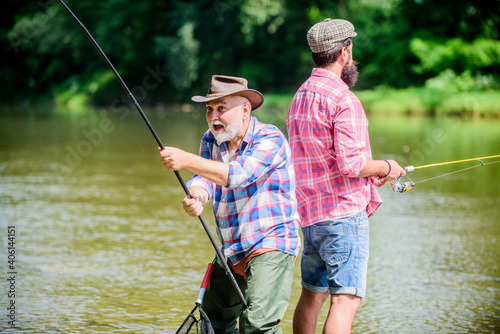 Hobby sport activity. Summer weekend. Peaceful activity. Nice catch. Rod and tackle. Father and son fishing. Fisherman fishing equipment. Fisherman grandpa and mature man friends. Fisherman family