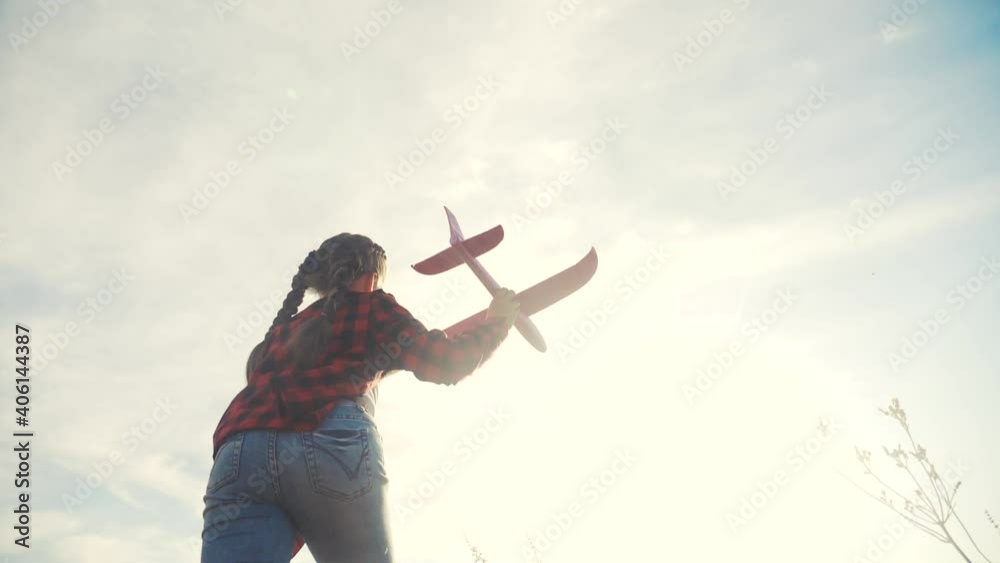 happy girl child run with an airplane. kid silhouette play plane. happy family dream freedom airplane concept. daughter kid run on wheat field at sunset holds in his hands fun dream toy aircraft happy girl child run with an airplane. kid silhouette play plane. happy family dream freedom airplane concept. daughter kid run on wheat field at sunset holds in his hands fun dream toy aircraft