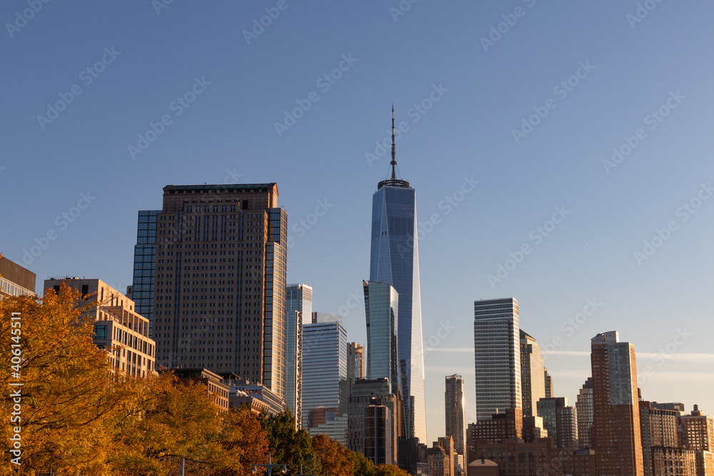 Lower Manhattan Skyline during Autumn with Colorful Trees in New York City