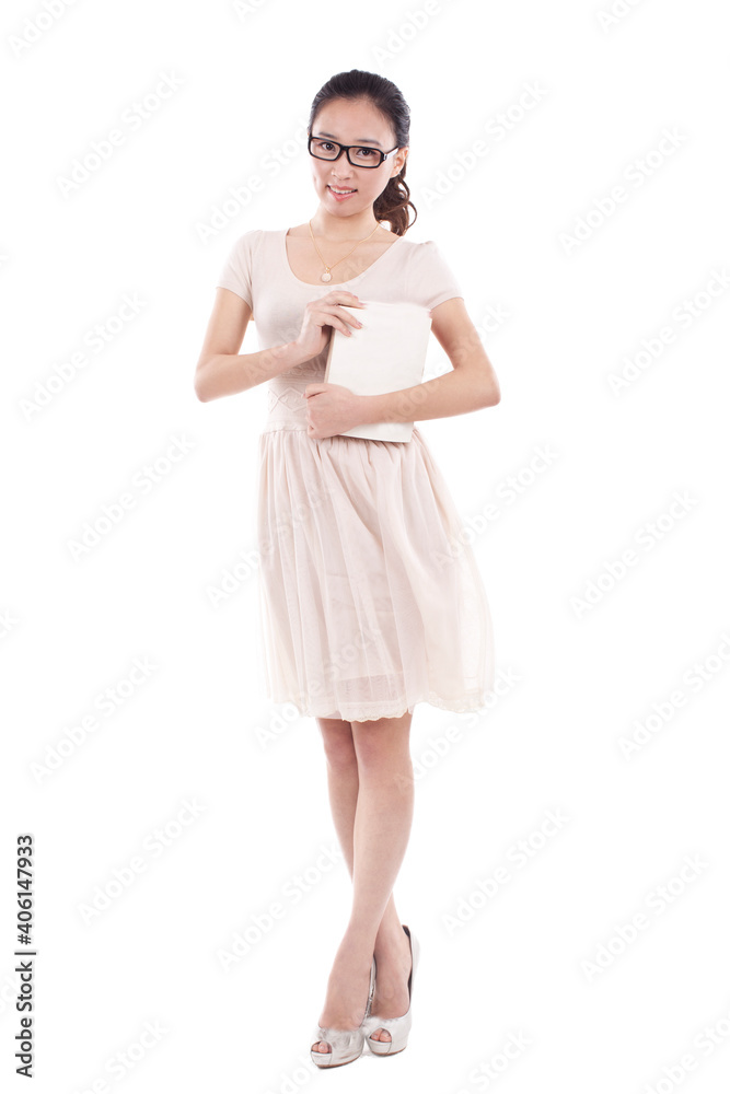 A Young woman standing, hugging a book A Young woman standing, hugging a book