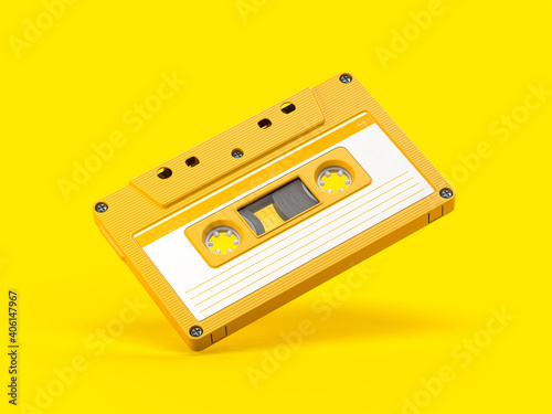 Leinwand Poster Yellow vintage audio cassette on yellow background.