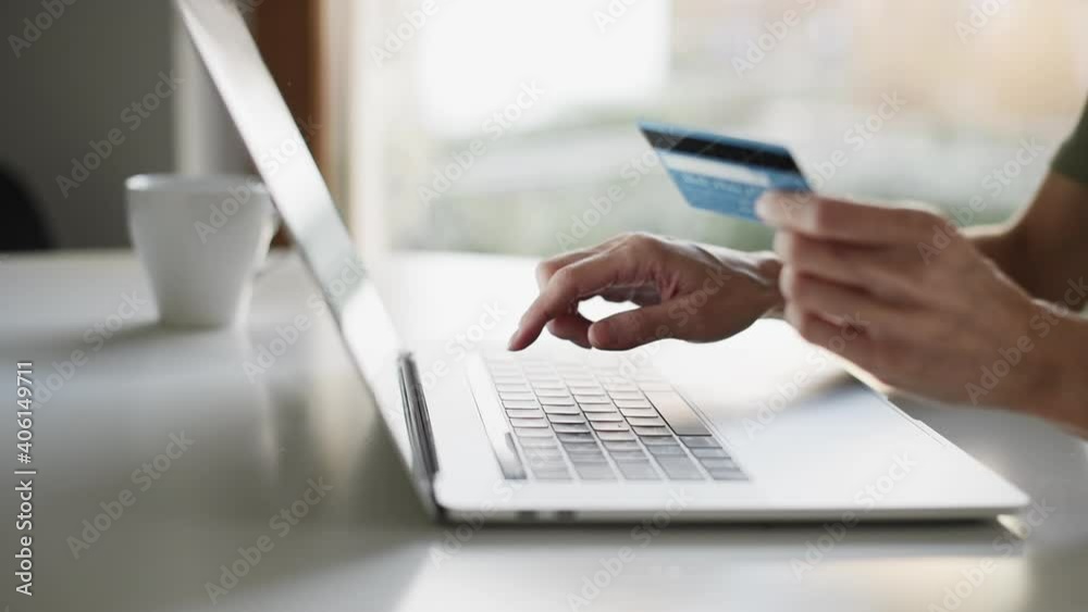 Woman making online payment with credit card and laptop. Business, online shopping, e-commerce, internet banking, spending money, working from home concept