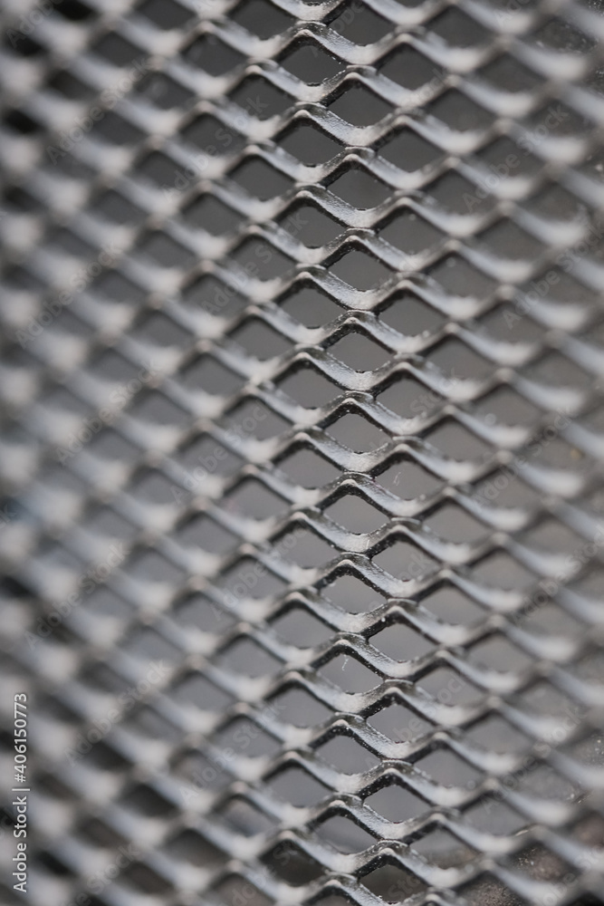 Texture in the form of rhombuses. Black metal mesh. Texture in the form of rhombuses. Black metal mesh.