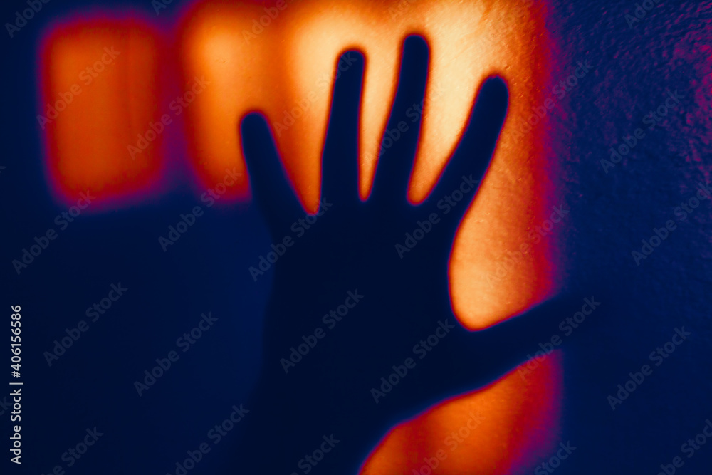 Shadow of the hand on the wall