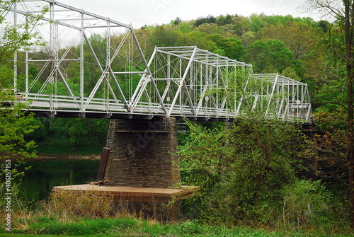 The Dingmans Ferry Bridge spans the Delaware River between New Jersey and Pennsylvania photo