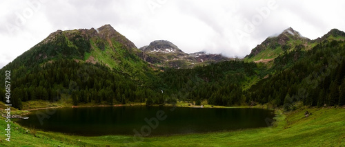 Принти на полотні soft green lake in a green valley high in the mountains panorama