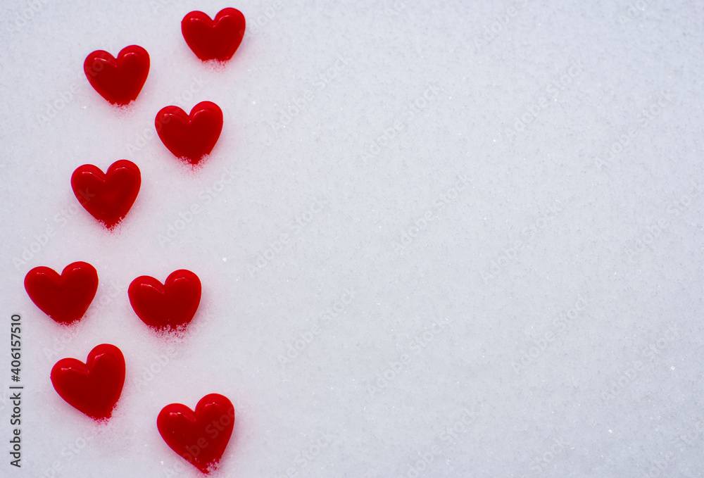 Bright red hearts on natural white snow. Copy space. Happy Valentine day and love concept.Greeting card, mock-up