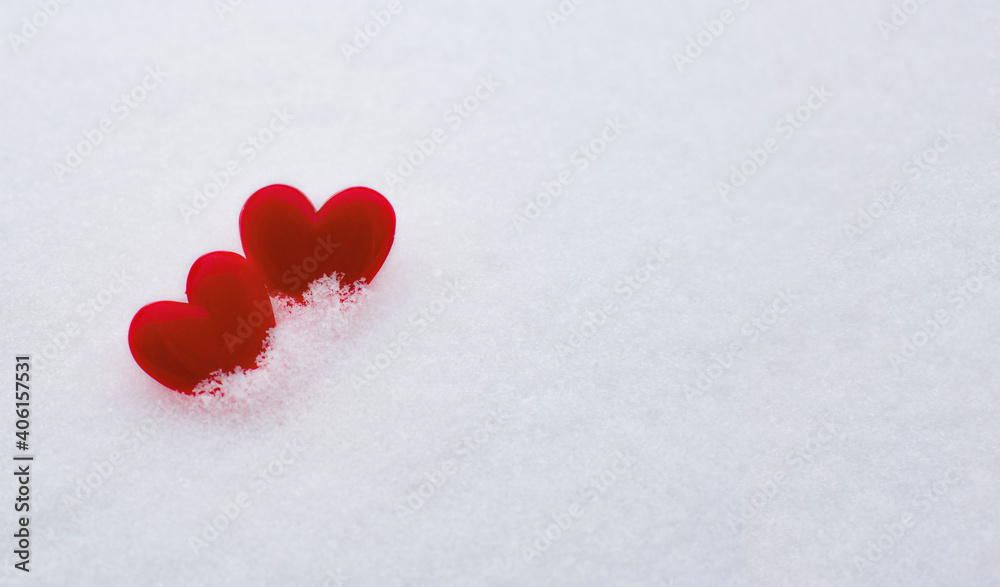 Bright red hearts on natural white snow. Copy space. Happy Valentine day and love concept.Greeting card, mock-up