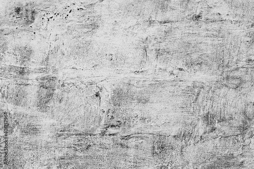 Texture of a concrete wall with cracks and scratches which can be used as a background