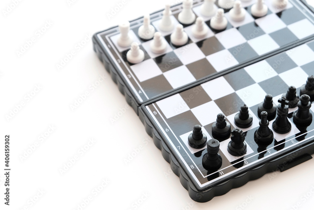 Magnetic chess with spaced figures on a white background. Recreation concept, sports intellectual game Magnetic chess with spaced figures on a white background. Recreation concept, sports intellectual game