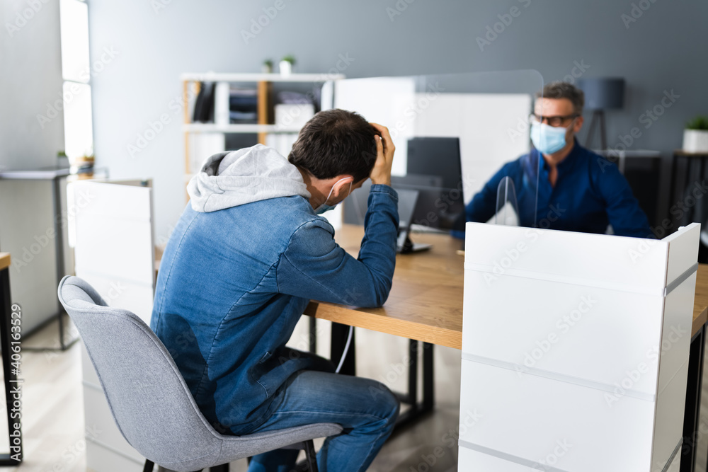 Sad Man In Meeting With Consultant In Bank Sad Man In Meeting With Consultant In Bank