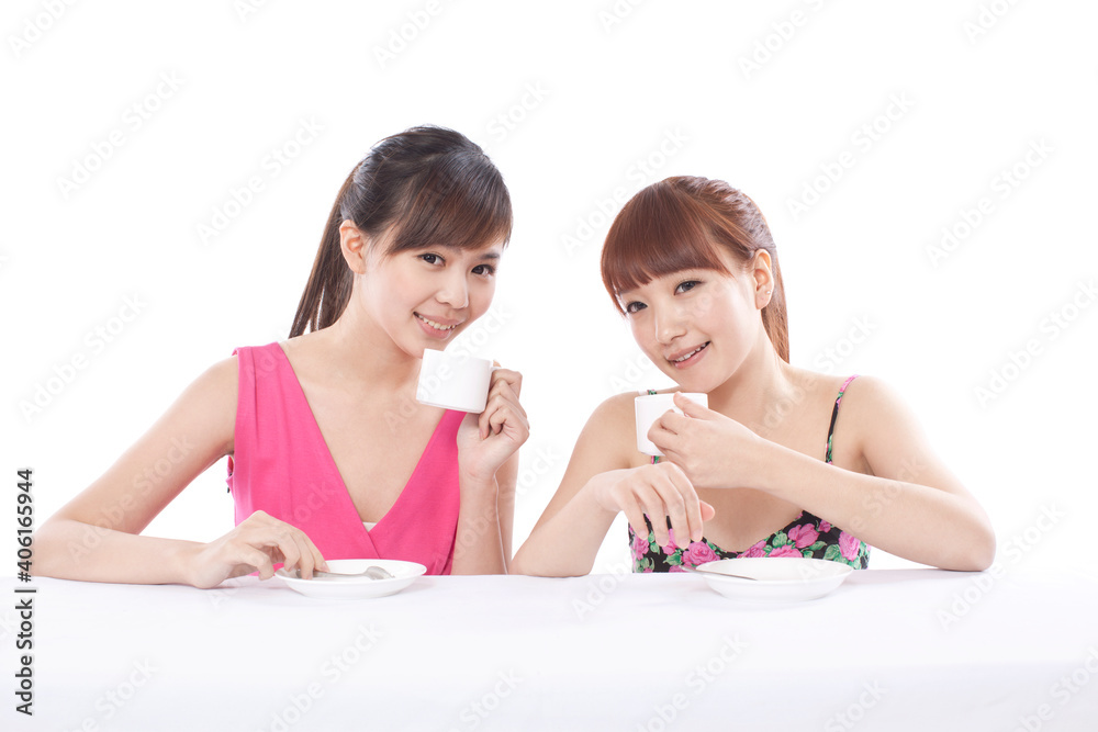 Portrait of two female friends drinking coffee Portrait of two female friends drinking coffee