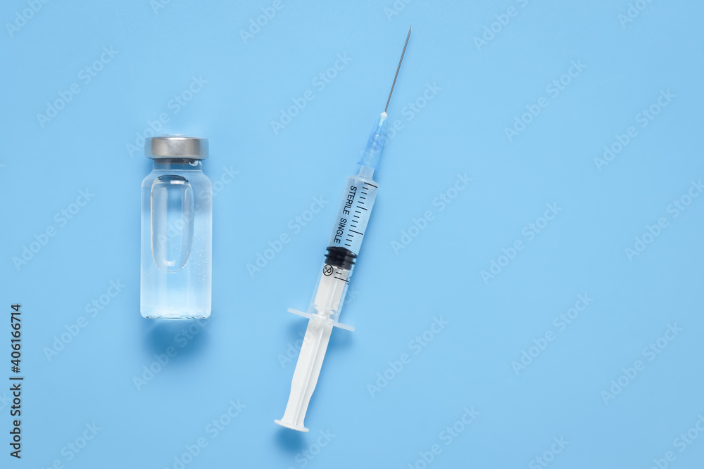 Virus protection vaccine, prevention concept, diabetes injection. A medical bottle with a clear liquid and a plastic medical syringe with a removable needle. Vaccination against coronavirus COVID-19. Virus protection vaccine, prevention concept, diabetes injection. A medical bottle with a clear liquid and a plastic medical syringe with a removable needle. Vaccination against coronavirus COVID-19.