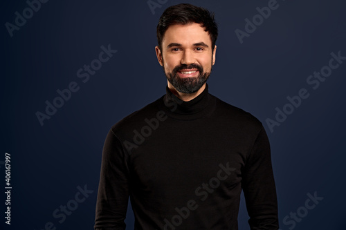 Close-up portrait of handsome successful businessman with beard, smiling happy and satisfied, express enthusiasm and positivity, staying on bright side, standing Pacific Blue background joyful