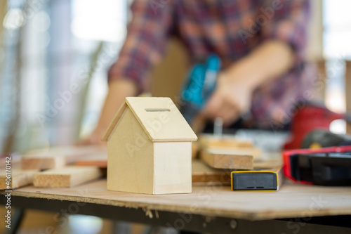 Asian engineer wearing safety hard hat in wood construction factory 
