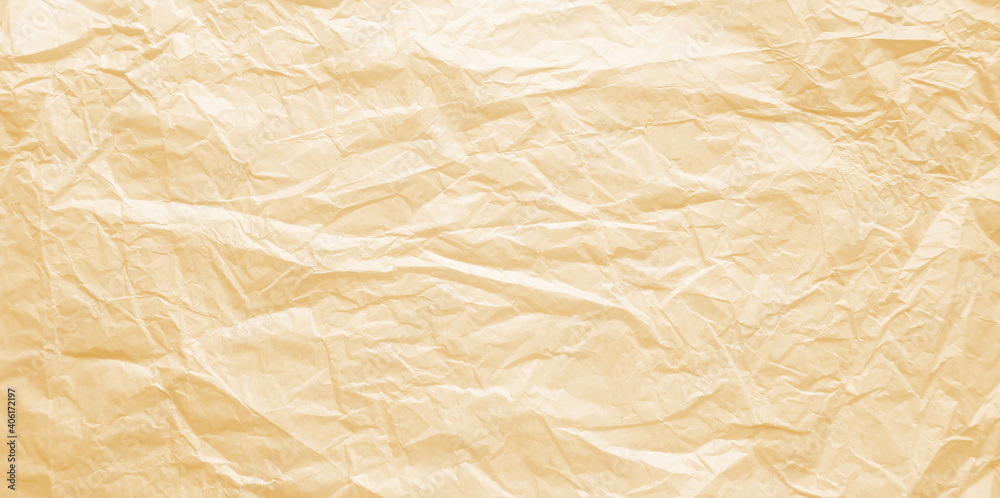 Worn, old, crumpled paper. Old Sepia photo. The background for the texture looks like crumpled parchment in yellow and brown