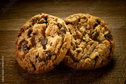 Two Cookies on Wooden Bakcground photo