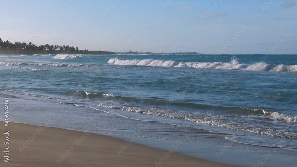 Sunset on macao beach with waves on the sea. Footprints on sandy shore. Bavaro seashore. Dominican Republic Sunset on macao beach with waves on the sea. Footprints on sandy shore. Bavaro seashore. Dominican Republic
