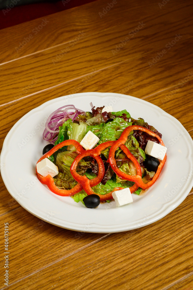 Salad with lettuce, pepper and parmesan cheese Salad with lettuce, pepper and parmesan cheese