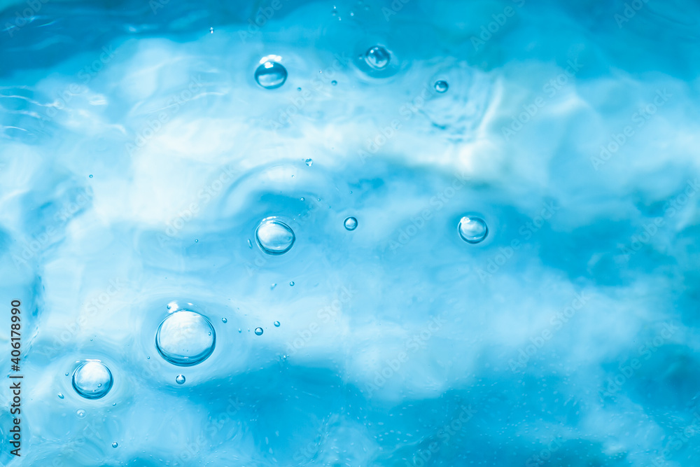 The texture of blue frozen water with bubbles and drops. The texture of blue frozen water with bubbles and drops.