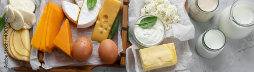 Fotografia Different fresh dairy products on gray background.
