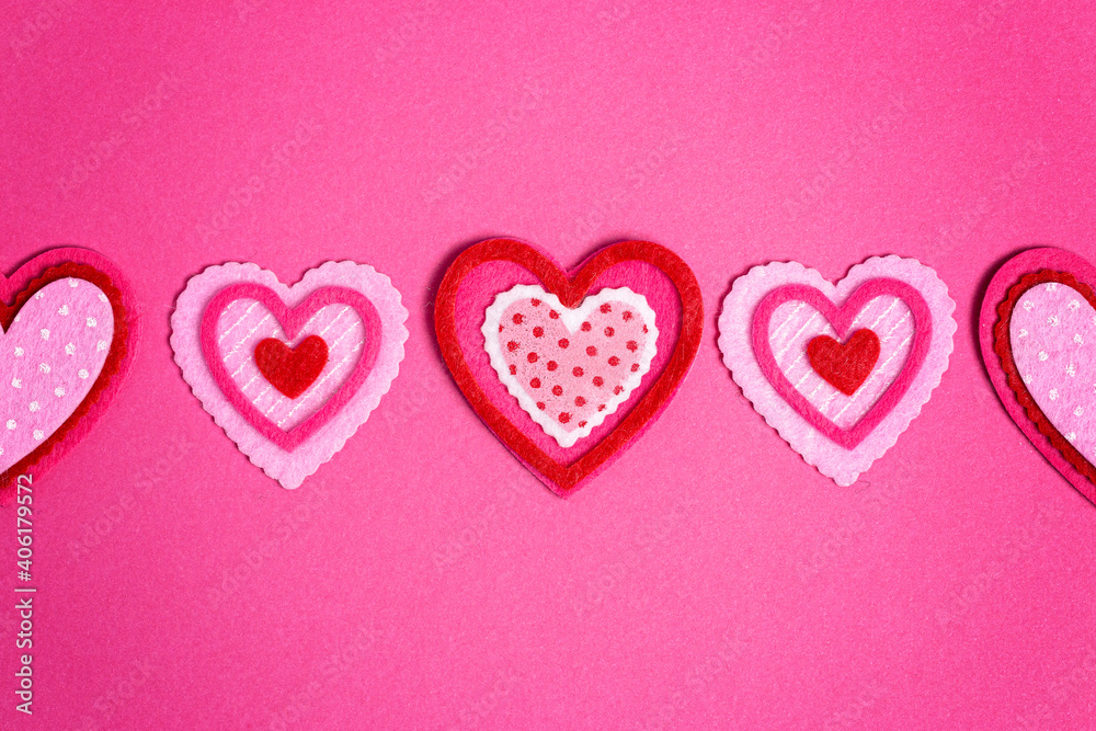 Simple Background with Felt Love Hearts on Pink Background