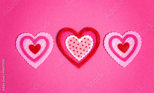 Simple Background with Felt Love Hearts on Pink Background