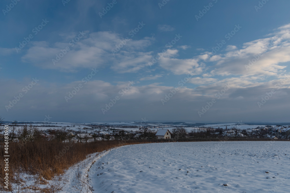 Sunset view near Celoznice village and Kyjov town in winter cold evening