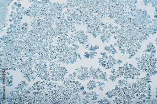 Abstract frosty pattern on glass, background texture © andrei310