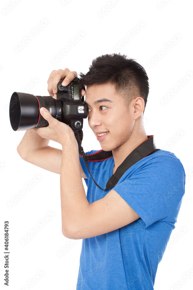 Portrait of a young Photographer holding camera Portrait of a young Photographer holding camera