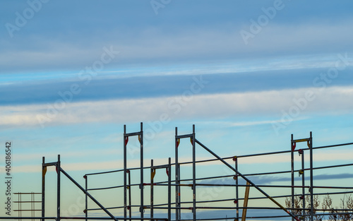 Scaffolding of construction site on blue sky strips background
