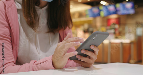 Woman use of smart phone at restaurant