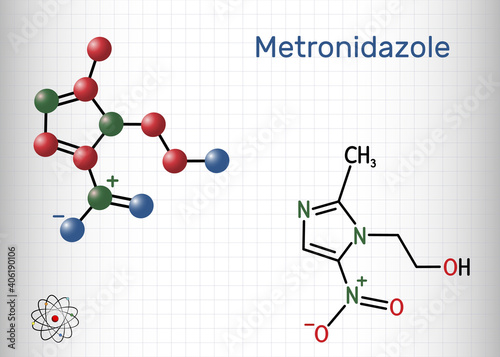 Metronidazole, antiprotozoal medication molecule. It is antibiotic, belonging to the nitroimidazole class of antibiotics. Structural chemical formula and molecule model. Sheet of paper in a cage