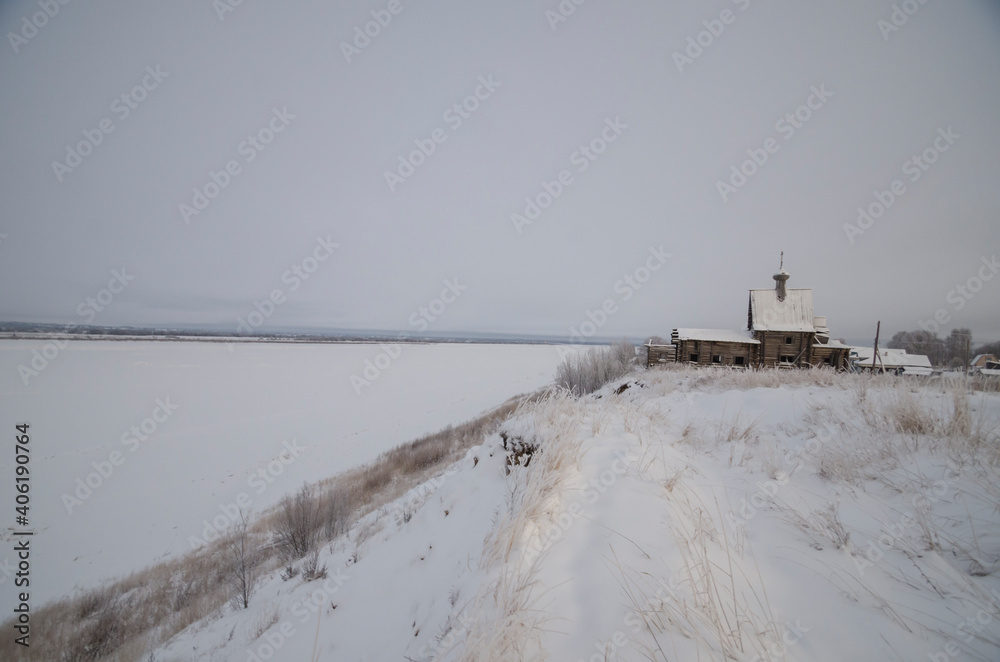 December, 2020 - Chukhcherma. The ancient wooden church of St. Basil the Blessed in the northern village. Russia, Arkhangelsk region, the village of Srednepogostskaya
