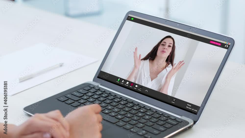 Video call. Virtual interview. Online communication. Corporate telework. Confident successful woman speaking to female colleague on laptop screen at light home office workplace. Video call. Virtual interview. Online communication. Corporate telework. Confident successful woman speaking to female colleague on laptop screen at light home office workplace.