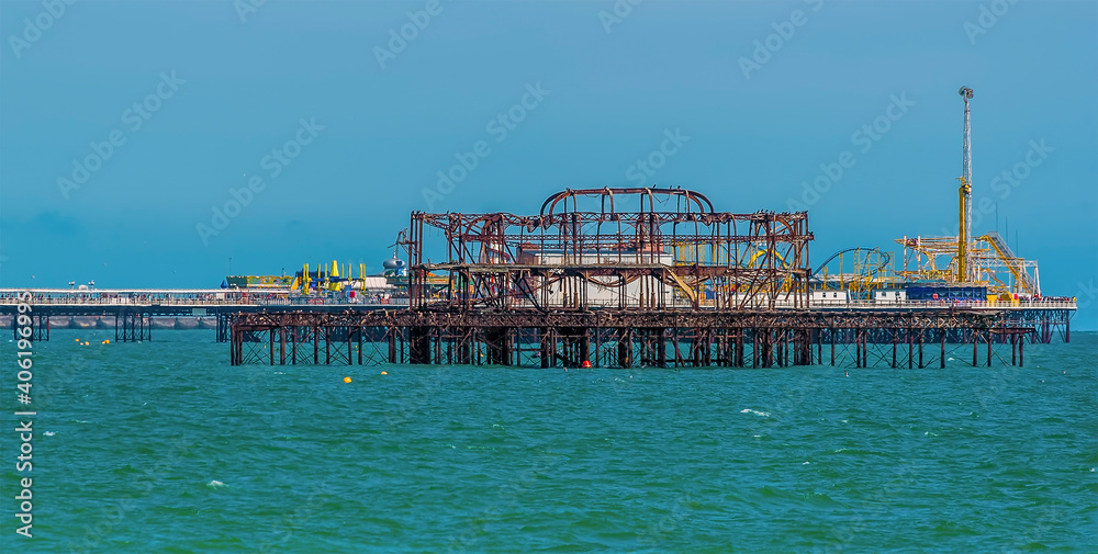 A view of the two piers in Brighton. UK in summertime A view of the two piers in Brighton. UK in summertime
