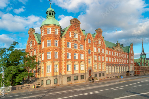 Old stock exchange building illuminated by sunrise in early morning, Copenhagen, Denmark, summer time, paste space