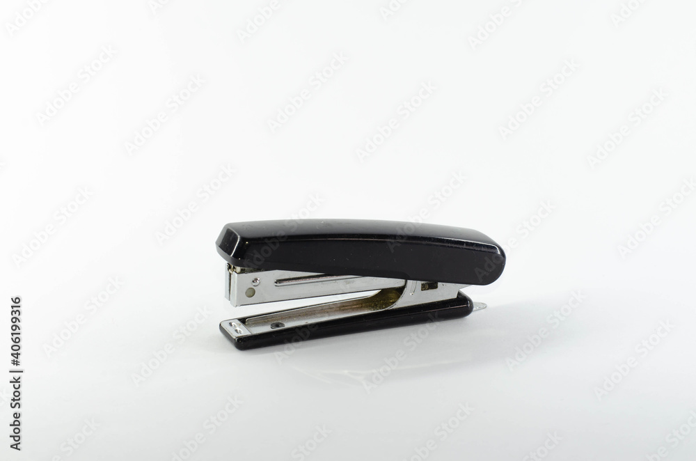 Stapler. Stationery tool. Puncher for paper. Isolated image. Stapler. Stationery tool. Puncher for paper. Isolated image.