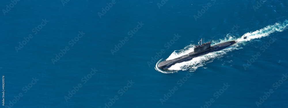Aerial drone ultra wide panoramic photo of latest technology navy armed diesel powered submarine cruising half submerged
