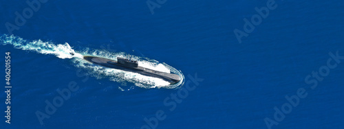Aerial drone ultra wide panoramic photo of latest technology armed diesel powered submarine cruising half submerged © aerial-drone