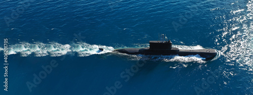 Aerial drone ultra wide panoramic photo of latest technology armed diesel powered submarine cruising half submerged open ocean sea photo