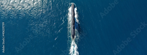 Aerial drone ultra wide panoramic photo of latest technology navy armed diesel powered submarine cruising half submerged photo