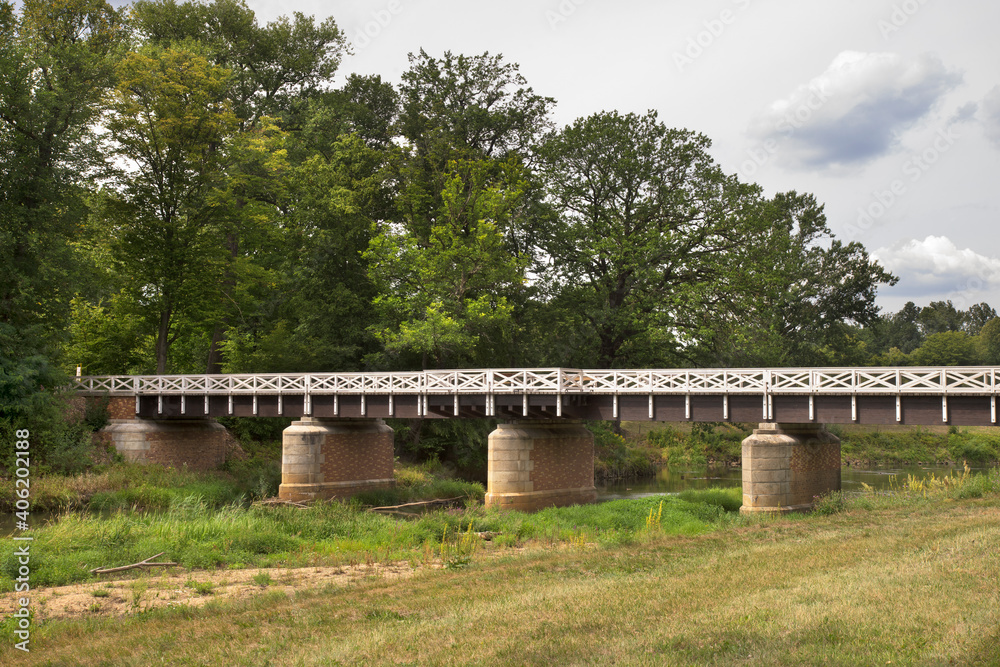 Double bridge (Doppelbrucke) between Poland and Germany over Nysa Luzycka (Lausitzer Neisse) river at park Muzakowski (Park von Muskau) near Leknica. UNESCO World Heritage Site. Poland Double bridge (Doppelbrucke) between Poland and Germany over Nysa Luzycka (Lausitzer Neisse) river at park Muzakowski (Park von Muskau) near Leknica. UNESCO World Heritage Site. Poland