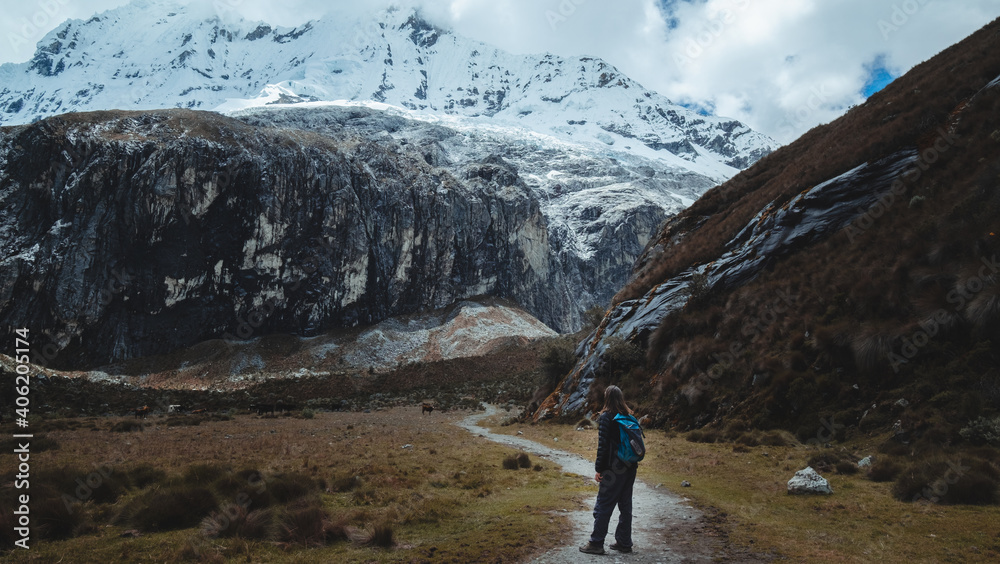 Hiker looks the snowy peaks Chakrarahu on the way to Lagoon 69 in Cordillera Blanca, Peru.