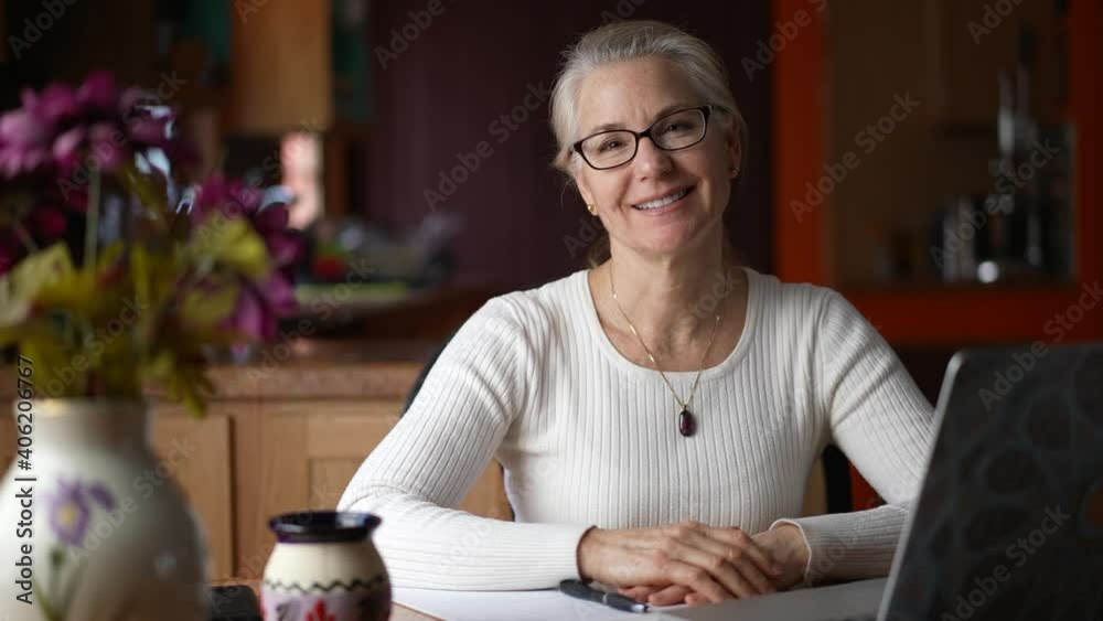 Portrait of remote business woman smiling looking at camera, webcam point of view in home. Happy teacher doing video chat. Portrait of remote business woman smiling looking at camera, webcam point of view in home. Happy teacher doing video chat.